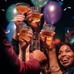 a group of people holding up glasses of wine